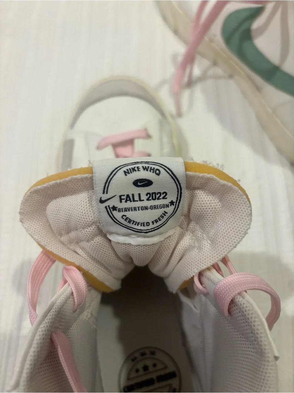 Nike Women’s White High-Top Lace-Up Boots with Pink Laces and Green Swoosh